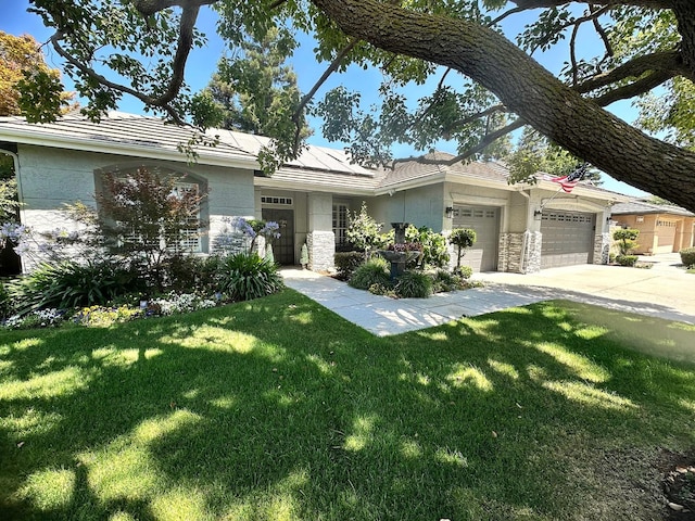 7310 N Katy Ave, Fresno, CA 93722 - view of front of property with stone siding, a garage, a front lawn, concrete driveway, and stucco siding