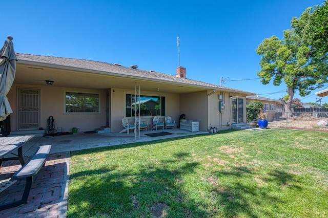 3625 E Cortland Ave, Fresno, CA 93726 - rear view of house with stucco siding, a chimney, a patio area, and entry steps