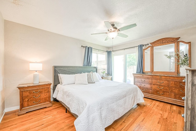 3625 E Cortland Ave, Fresno, CA 93726 - bedroom featuring light wood finished floors, a textured ceiling, and a ceiling fan