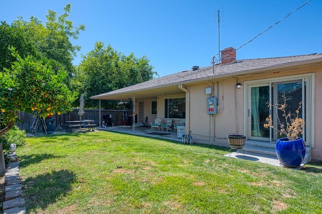 3625 E Cortland Ave, Fresno, CA 93726 - back of property with entry steps, a patio area, a chimney, and stucco siding