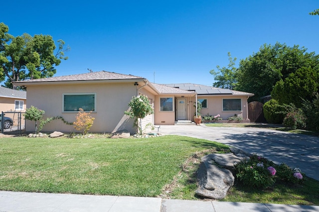 3625 E Cortland Ave, Fresno, CA 93726 - ranch-style house featuring concrete driveway, solar panels, stucco siding, and a gate