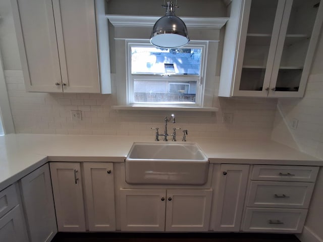 535 E Princeton Ave, Fresno, CA 93704 - kitchen featuring white cabinets, tasteful backsplash, light countertops, and glass insert cabinets