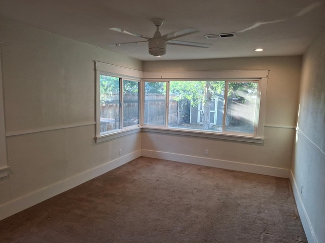 535 E Princeton Ave, Fresno, CA 93704 - carpeted empty room with a ceiling fan and plenty of natural light