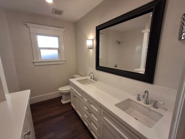 535 E Princeton Ave, Fresno, CA 93704 - full bathroom featuring backsplash, double vanity, wood finished floors, and a shower
