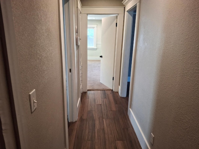 535 E Princeton Ave, Fresno, CA 93704 - corridor featuring a textured wall and dark wood finished floors