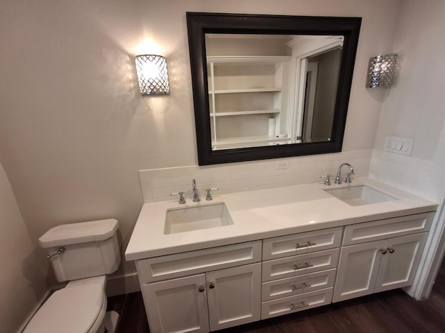 535 E Princeton Ave, Fresno, CA 93704 - bathroom with backsplash, double vanity, and wood finished floors
