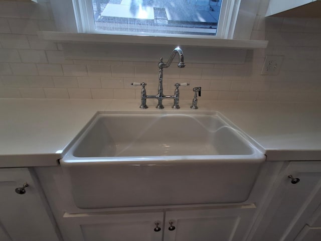 535 E Princeton Ave, Fresno, CA 93704 - kitchen view of decorative backsplash, white cabinetry, and light countertops