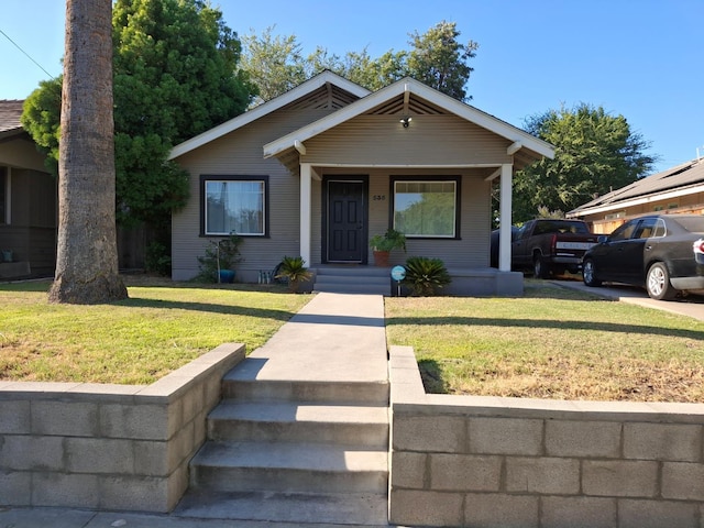 535 E Princeton Ave, Fresno, CA 93704 - view of front of home with a front lawn and covered porch
