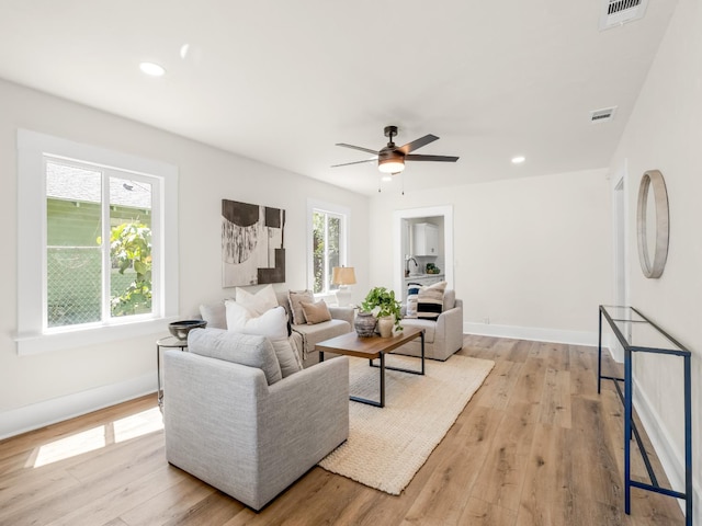 3644 E Illinois Ave, Fresno, CA 93702 - living area with light wood-type flooring, ceiling fan, and recessed lighting
