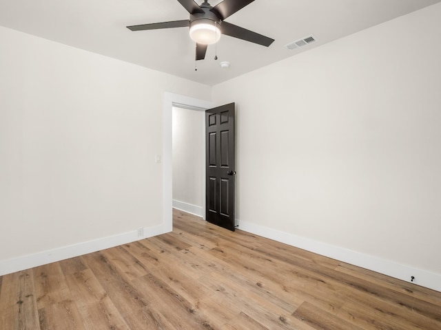 3644 E Illinois Ave, Fresno, CA 93702 - empty room with light wood-style flooring, ceiling fan, and a smoke detector