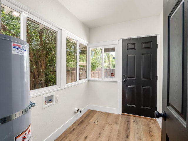3644 E Illinois Ave, Fresno, CA 93702 - unfurnished sunroom featuring water heater and wood finished floors