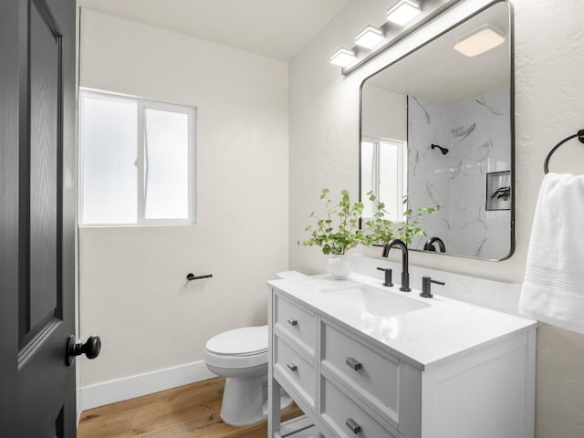 3644 E Illinois Ave, Fresno, CA 93702 - full bathroom with vanity, wood finished floors, and a marble finish shower