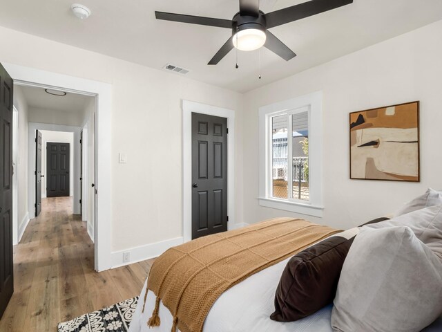 3644 E Illinois Ave, Fresno, CA 93702 - bedroom with light wood finished floors and a ceiling fan
