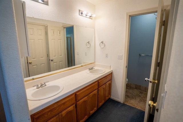 38475 Sierra Lakes Dr, Oakhurst, CA 93644 - full bathroom featuring double vanity and tile patterned flooring