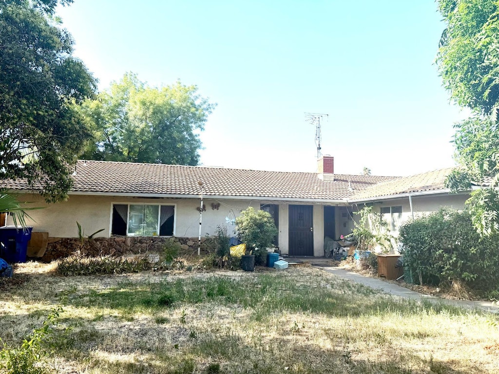 5167 E Dwight Way, Fresno, CA 93727 - back of property with a tile roof, a chimney, and stucco siding
