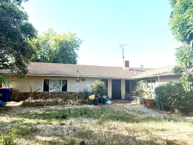 5167 E Dwight Way, Fresno, CA 93727 - back of property with a tile roof, a chimney, and stucco siding