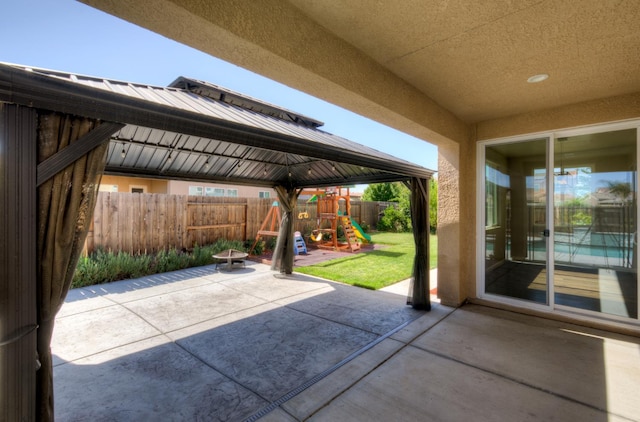 1072 Soledad Ave, Clovis, CA 93619 - fenced backyard featuring a patio area and a playground