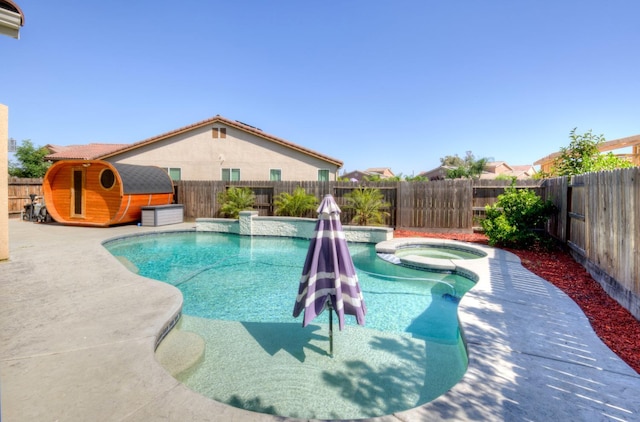 1072 Soledad Ave, Clovis, CA 93619 - view of swimming pool with a fenced backyard, a shed, and a pool with connected hot tub