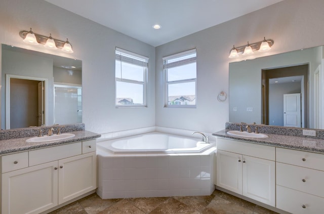 1072 Soledad Ave, Clovis, CA 93619 - bathroom with two vanities, a bath, and a stall shower