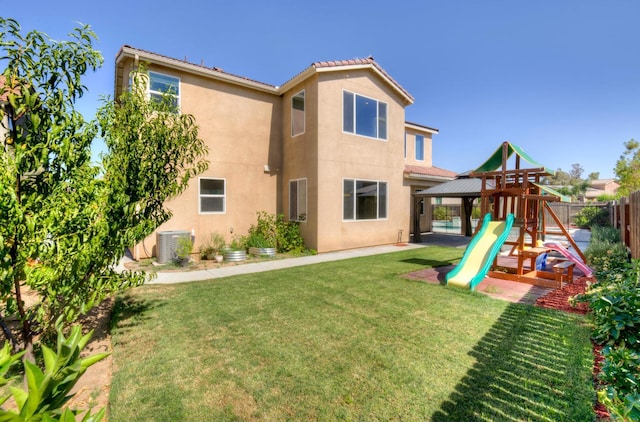 1072 Soledad Ave, Clovis, CA 93619 - back of property featuring a playground and stucco siding