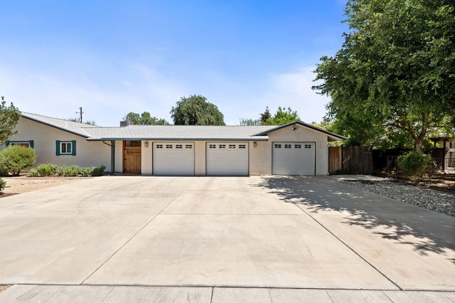 4760 N Rowell Ave, Fresno, CA 93726 - ranch-style house featuring an attached garage and concrete driveway