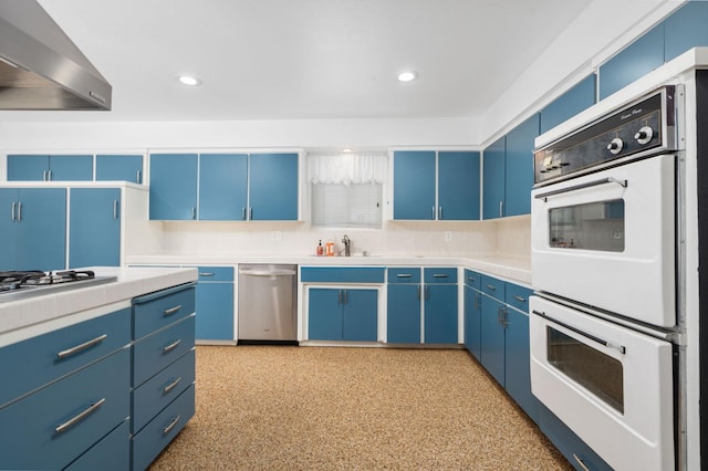 4760 N Rowell Ave, Fresno, CA 93726 - kitchen featuring dishwasher, wall chimney range hood, blue cabinets, white double oven, and recessed lighting