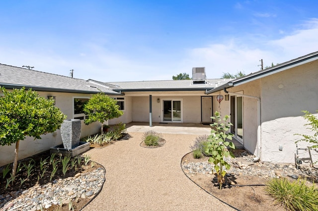 4760 N Rowell Ave, Fresno, CA 93726 - rear view of house featuring stucco siding and a patio area