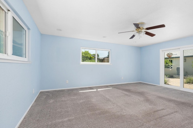 4760 N Rowell Ave, Fresno, CA 93726 - empty room featuring carpet, plenty of natural light, and a ceiling fan