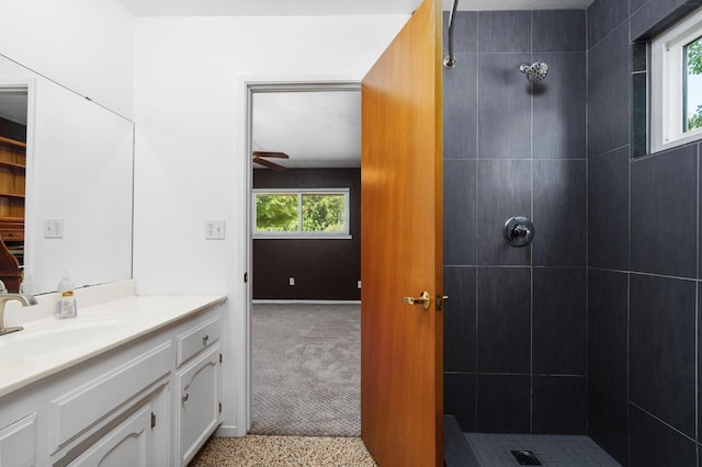 4760 N Rowell Ave, Fresno, CA 93726 - full bathroom with vanity, tiled shower, and ceiling fan