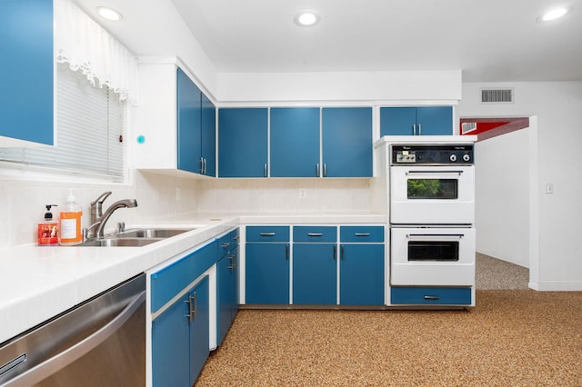 4760 N Rowell Ave, Fresno, CA 93726 - kitchen with white double oven, dishwasher, blue cabinetry, light countertops, and recessed lighting