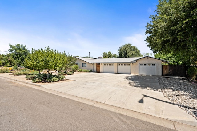 4760 N Rowell Ave, Fresno, CA 93726 - ranch-style house with driveway and an attached garage