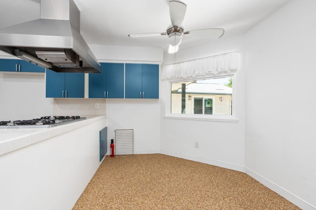 4760 N Rowell Ave, Fresno, CA 93726 - kitchen featuring blue cabinets, island range hood, stainless steel gas stovetop, a ceiling fan, and tile counters