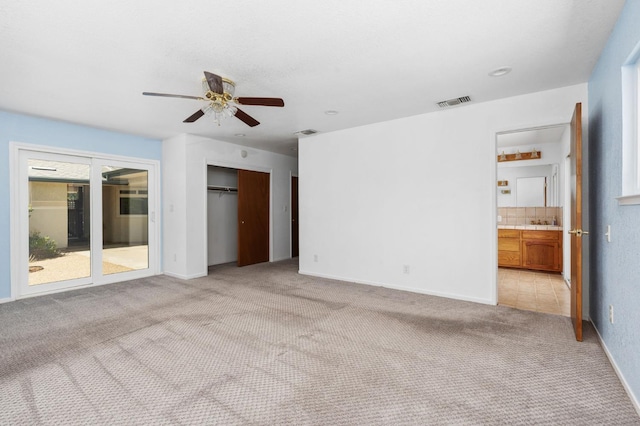 4760 N Rowell Ave, Fresno, CA 93726 - unfurnished living room with ceiling fan and light colored carpet
