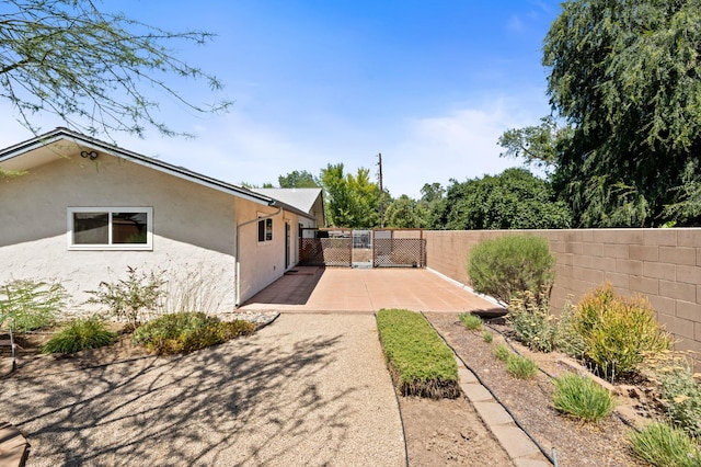 4760 N Rowell Ave, Fresno, CA 93726 - fenced backyard with a patio area