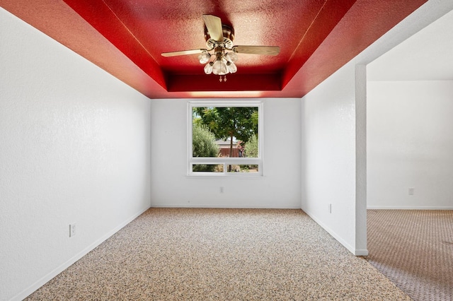 4760 N Rowell Ave, Fresno, CA 93726 - carpeted empty room featuring a tray ceiling and ceiling fan