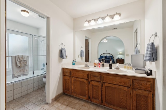 1059 E Fallbrook Ave, Fresno, CA 93720 - full bathroom with double vanity, tiled shower / bath combo, tile patterned floors, and ensuite bathroom