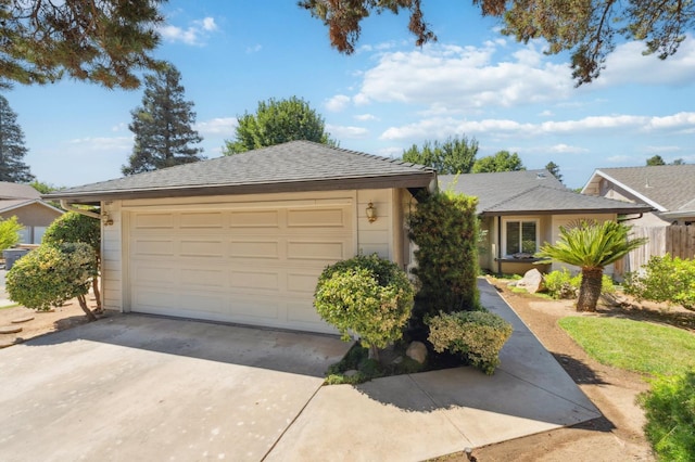 1059 E Fallbrook Ave, Fresno, CA 93720 - ranch-style house featuring a garage and driveway