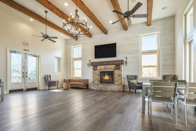 3613 Utah Ln, Clovis, CA 93619 - living area featuring ceiling fan, a stone fireplace, recessed lighting, dark wood-style flooring, and a chandelier