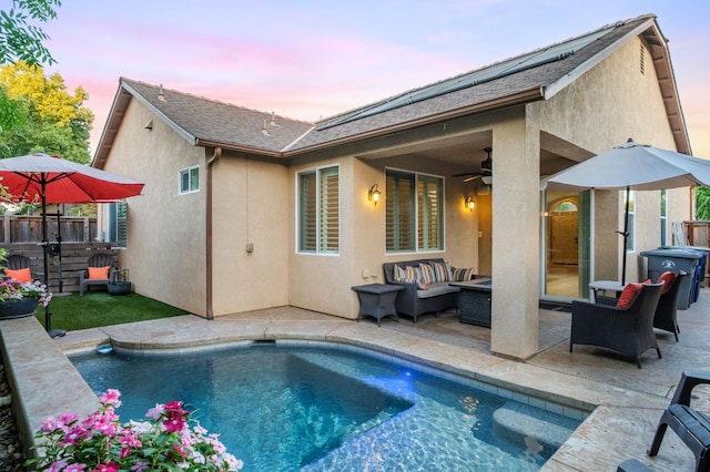 3613 Utah Ln, Clovis, CA 93619 - pool at dusk featuring an outdoor hangout area, a patio, and an outdoor pool