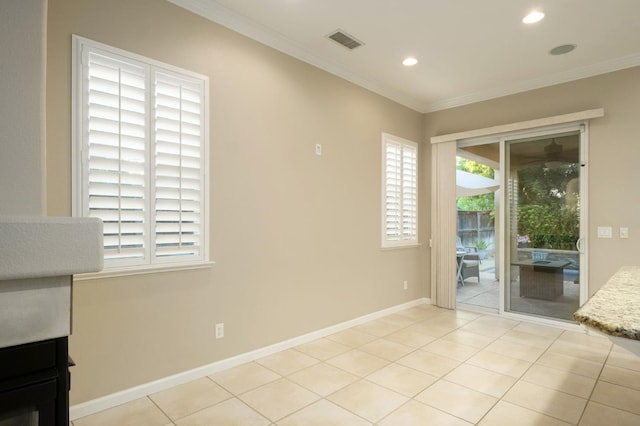 3613 Utah Ln, Clovis, CA 93619 - spare room with crown molding, recessed lighting, and light tile patterned floors