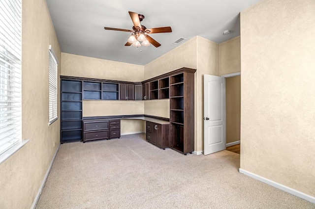 2663 E Spice Way, Fresno, CA 93720 - unfurnished office with light colored carpet, ceiling fan, built in study area, and a textured wall