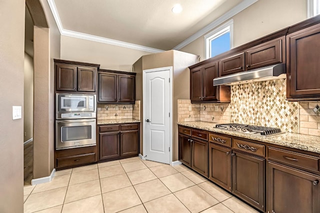 2663 E Spice Way, Fresno, CA 93720 - kitchen featuring stainless steel appliances, under cabinet range hood, ornamental molding, light stone counters, and dark brown cabinetry