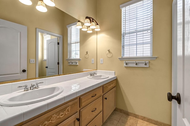 2663 E Spice Way, Fresno, CA 93720 - bathroom with double vanity, tile patterned floors, and a chandelier