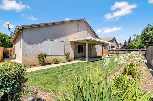 2663 E Spice Way, Fresno, CA 93720 - back of property featuring stucco siding, a patio, and a fenced backyard