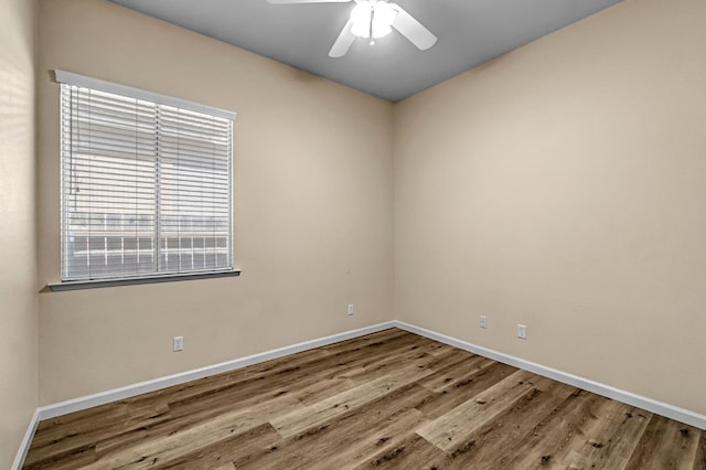 2663 E Spice Way, Fresno, CA 93720 - empty room featuring wood finished floors, healthy amount of natural light, and a ceiling fan