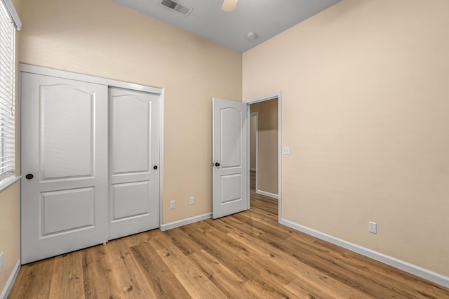 2663 E Spice Way, Fresno, CA 93720 - unfurnished bedroom with light wood-style flooring, a closet, and ceiling fan