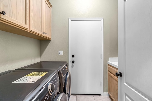 2663 E Spice Way, Fresno, CA 93720 - laundry area with washer and dryer, cabinet space, and light tile patterned floors