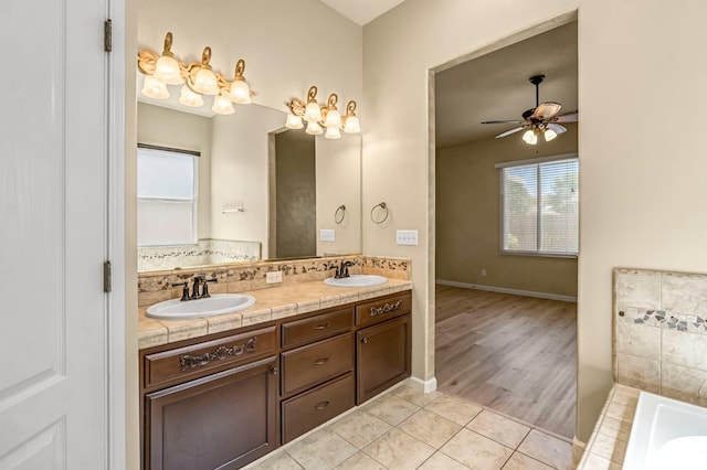 2663 E Spice Way, Fresno, CA 93720 - bathroom with double vanity, ceiling fan, a tub to relax in, and tile patterned flooring