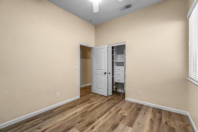 2663 E Spice Way, Fresno, CA 93720 - unfurnished bedroom featuring wood finished floors, a closet, and a ceiling fan