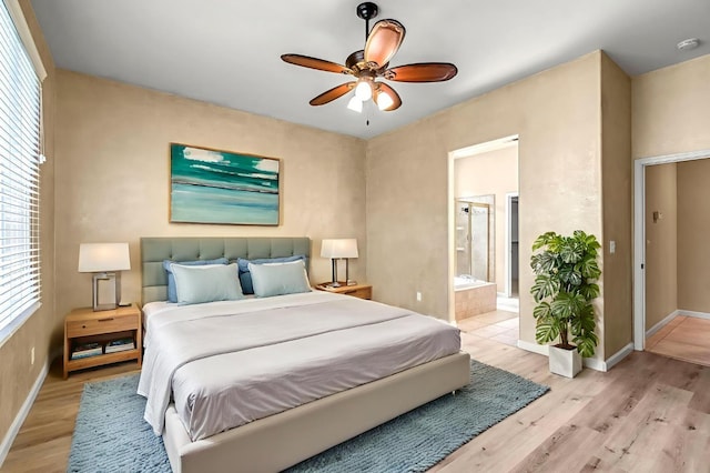 2663 E Spice Way, Fresno, CA 93720 - bedroom featuring light wood-style flooring, connected bathroom, and ceiling fan